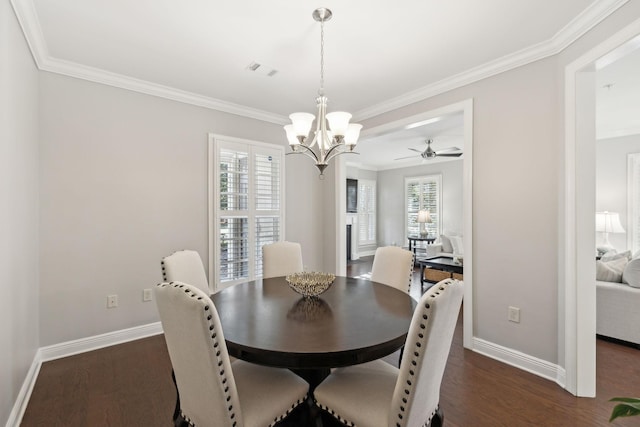 dining space featuring crown molding, dark wood-type flooring, and a notable chandelier