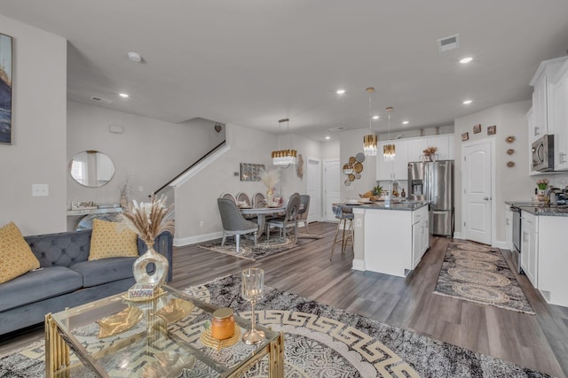 living room featuring dark hardwood / wood-style flooring