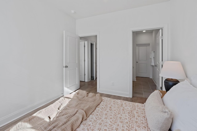 bedroom with hardwood / wood-style floors