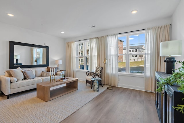 living room with light hardwood / wood-style flooring