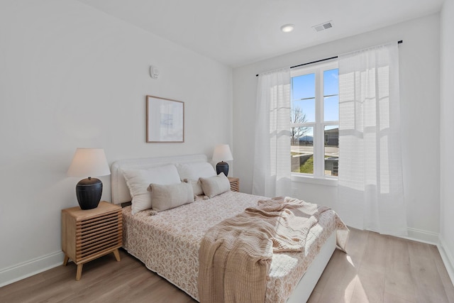 bedroom with light hardwood / wood-style flooring