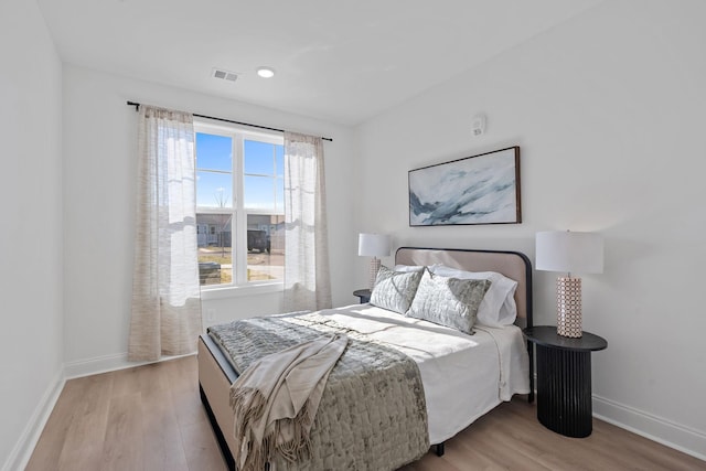 bedroom with light wood-type flooring