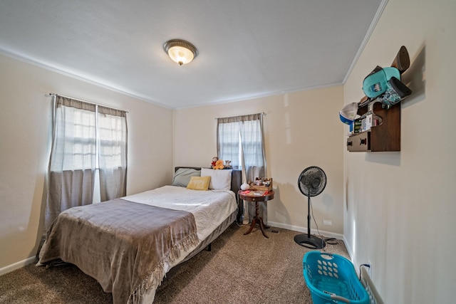 bedroom with multiple windows, crown molding, and carpet