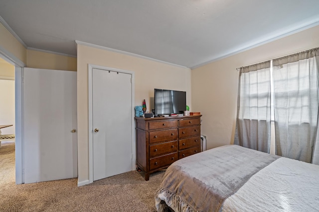 carpeted bedroom with ornamental molding