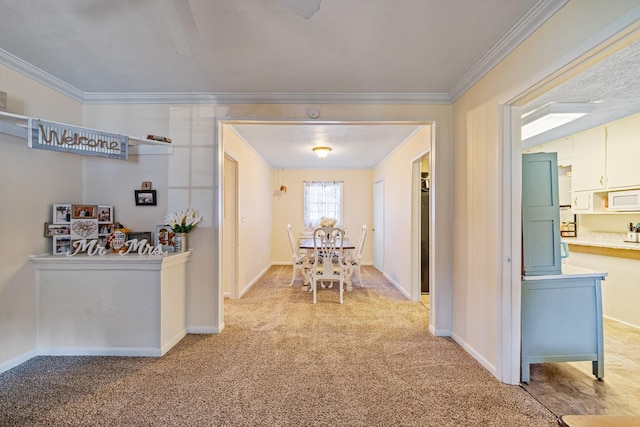 hallway with crown molding and light carpet