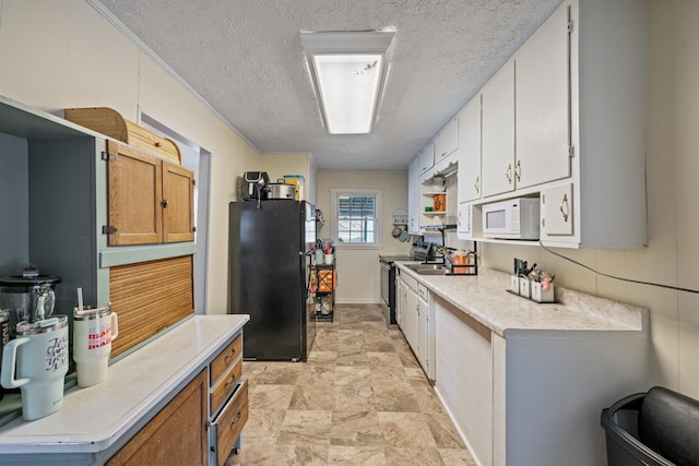 kitchen featuring black refrigerator, stainless steel electric stove, white cabinetry, and a textured ceiling