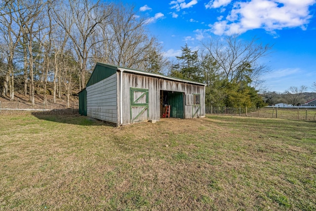 view of outdoor structure with a yard