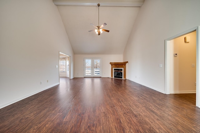 unfurnished living room with dark hardwood / wood-style flooring, french doors, ceiling fan, high vaulted ceiling, and beam ceiling