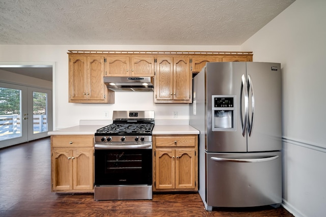 kitchen with french doors, appliances with stainless steel finishes, a textured ceiling, and dark hardwood / wood-style floors