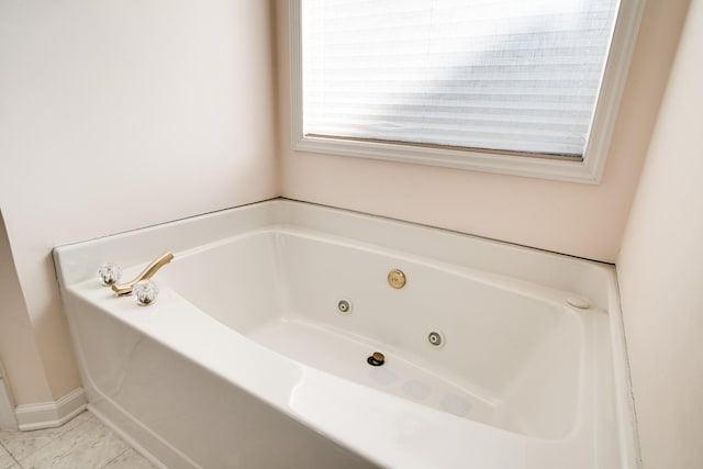 bathroom featuring tile patterned floors and a bathing tub