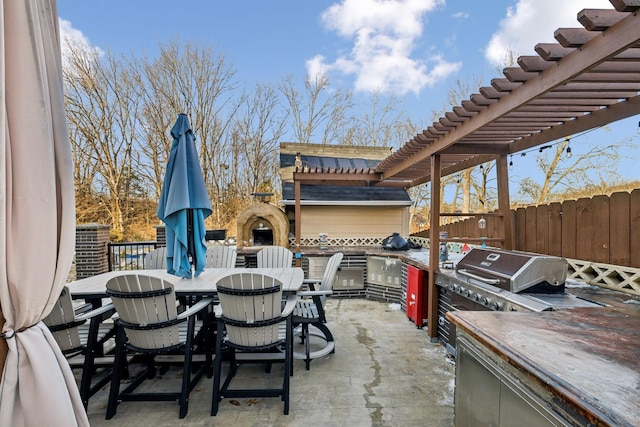 view of patio featuring a pergola, an outdoor fireplace, and area for grilling