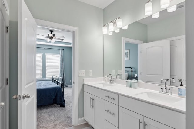 bathroom with ceiling fan and vanity