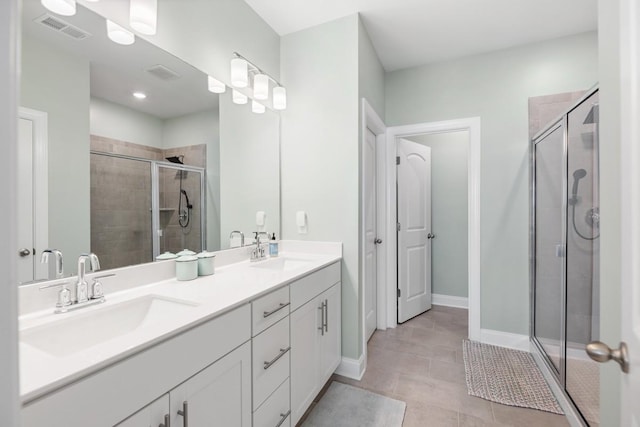 bathroom featuring tile patterned floors, walk in shower, and vanity