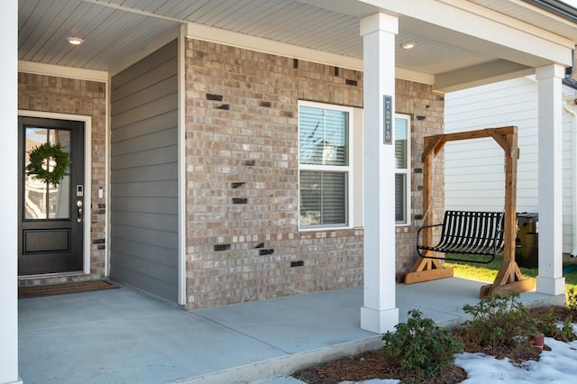 entrance to property with covered porch