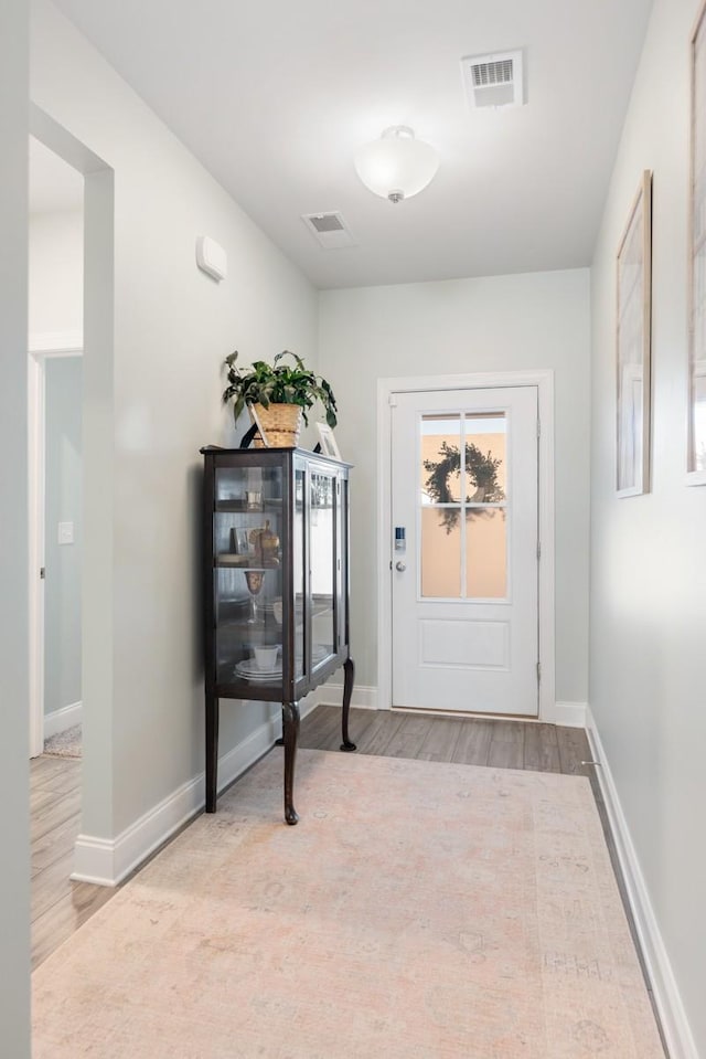 doorway to outside with light hardwood / wood-style flooring