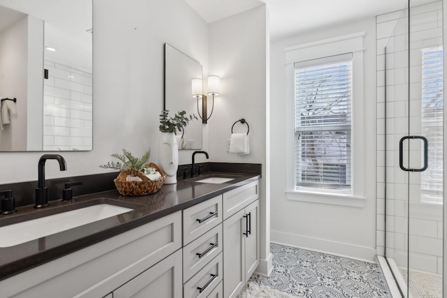 bathroom featuring vanity, an enclosed shower, and tile patterned floors