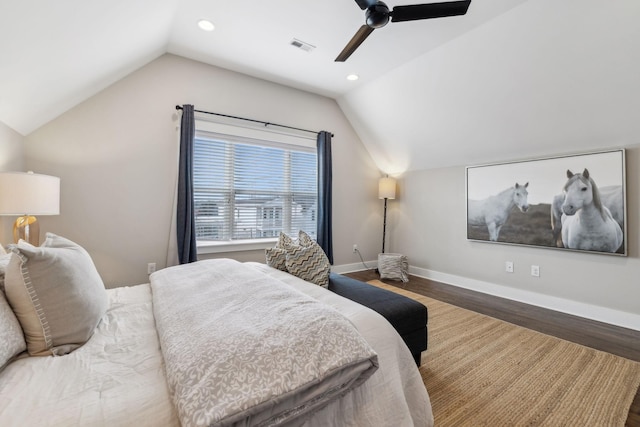 bedroom with lofted ceiling, hardwood / wood-style flooring, and ceiling fan