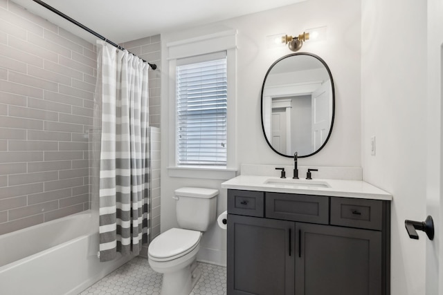 full bathroom featuring shower / bath combo, toilet, tile patterned floors, and vanity