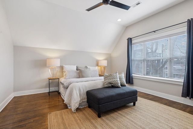 bedroom with dark wood-type flooring, vaulted ceiling, and ceiling fan