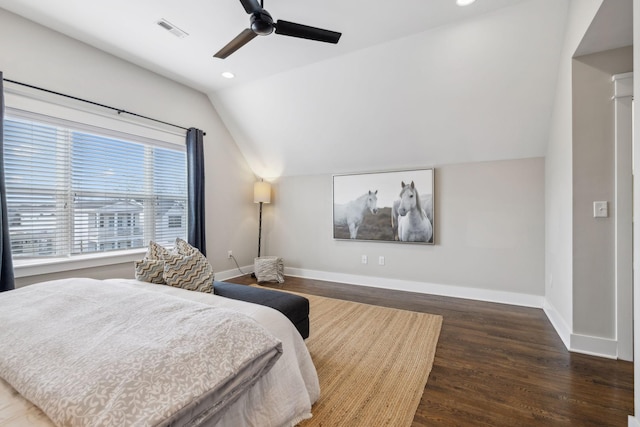 bedroom with vaulted ceiling, dark hardwood / wood-style floors, and ceiling fan