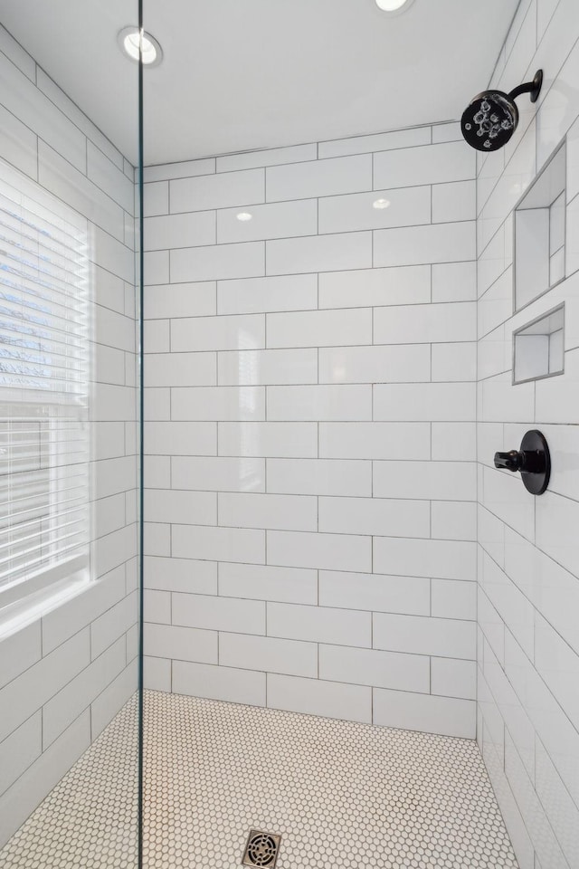 bathroom with tiled shower