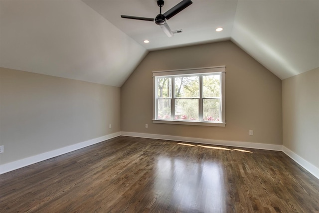 bonus room featuring lofted ceiling, dark wood-type flooring, and ceiling fan