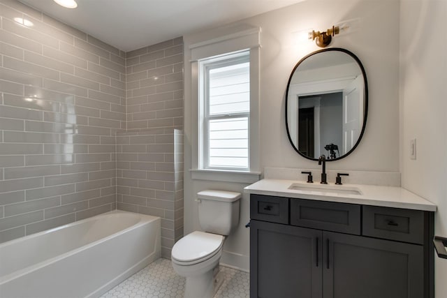 full bathroom featuring vanity, bathing tub / shower combination, tile patterned floors, and toilet