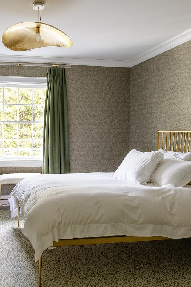 carpeted bedroom featuring crown molding