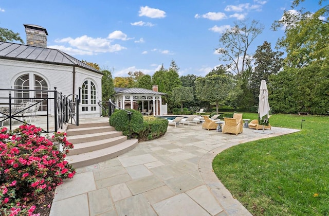 view of yard featuring a patio area, a gazebo, and french doors