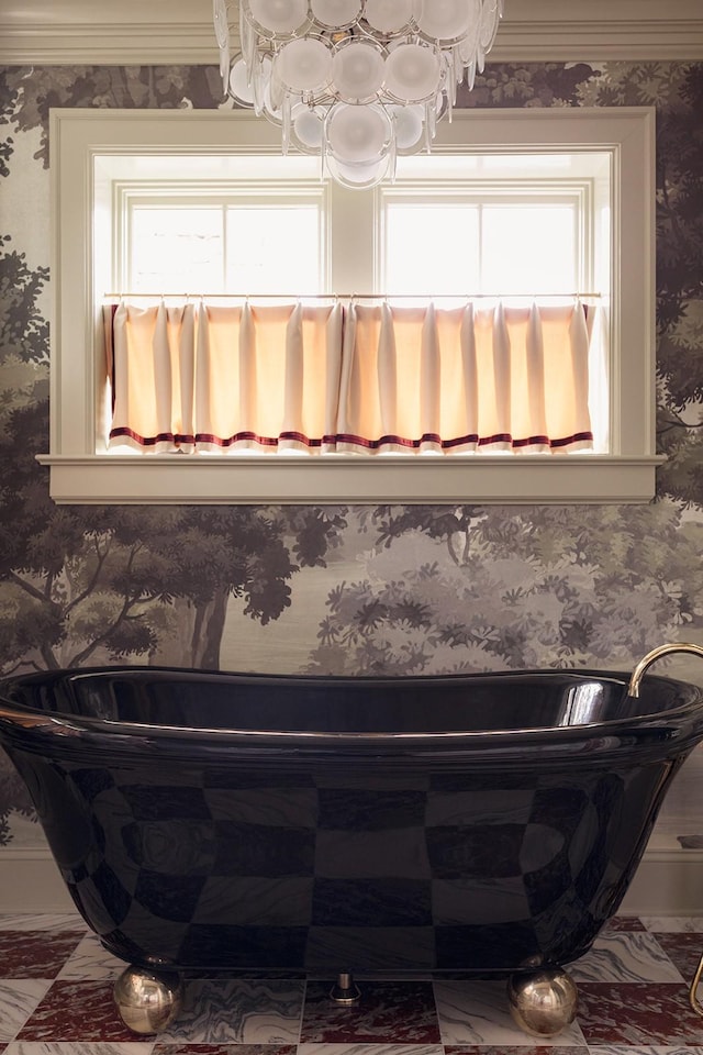 bathroom with plenty of natural light and a washtub