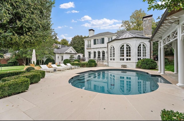 view of pool featuring a patio