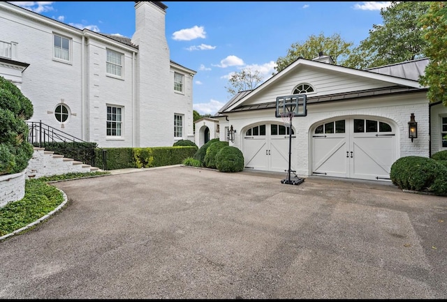 view of side of home with a garage