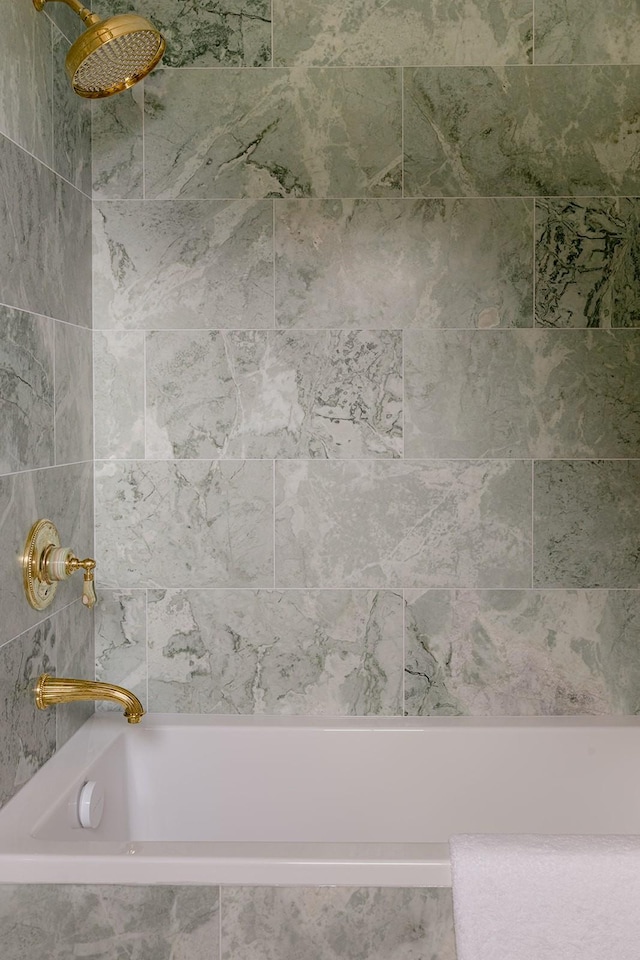 bathroom with tiled shower