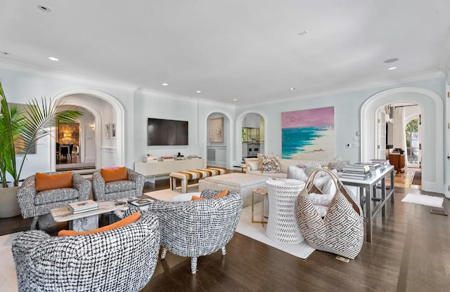 living room featuring dark hardwood / wood-style flooring and crown molding