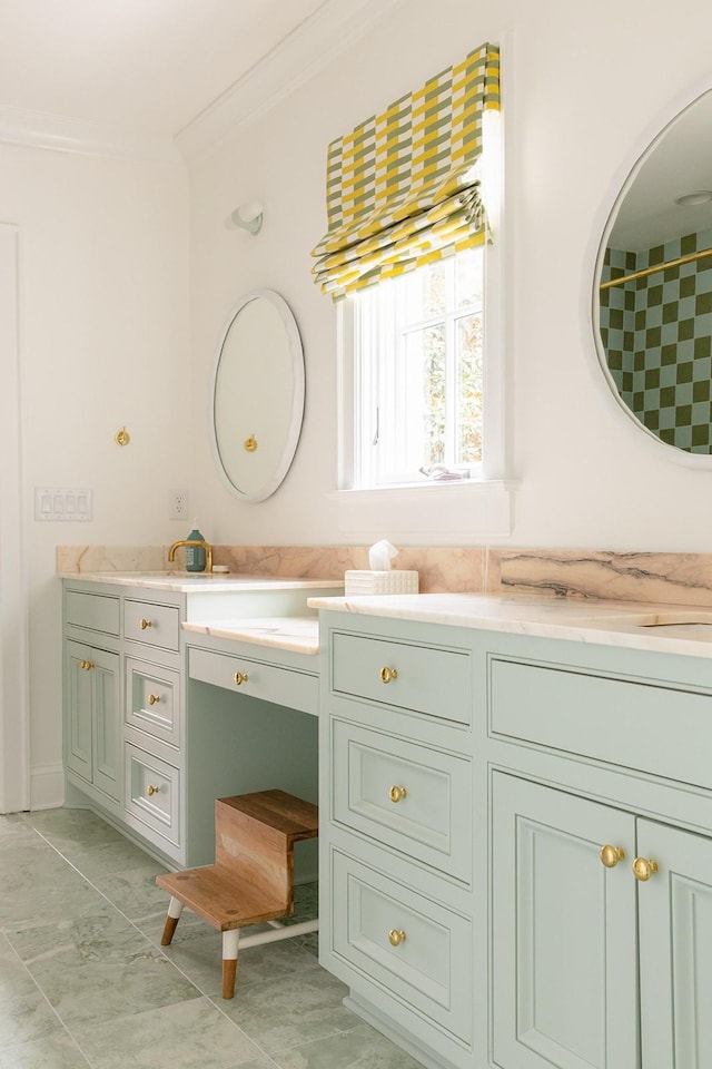 bathroom with vanity, ornamental molding, and tile patterned flooring