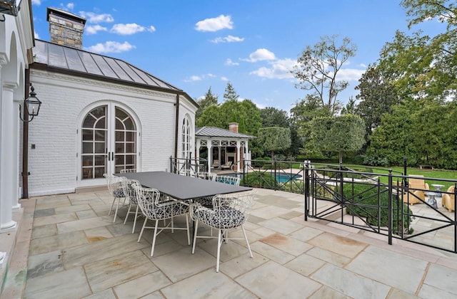 view of patio featuring a gazebo and french doors