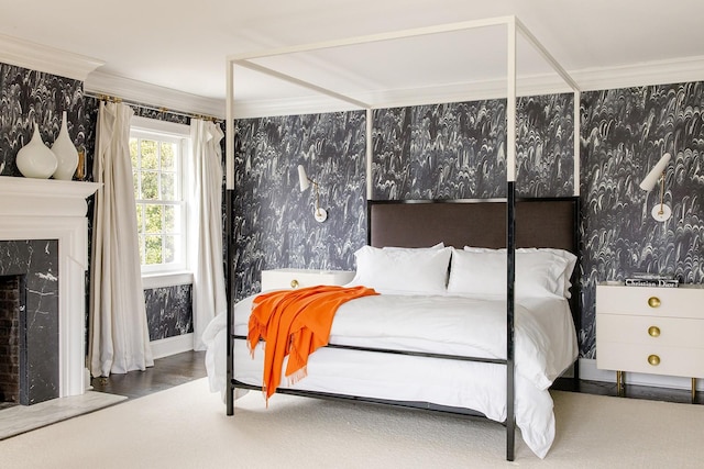 bedroom featuring ornamental molding and a fireplace