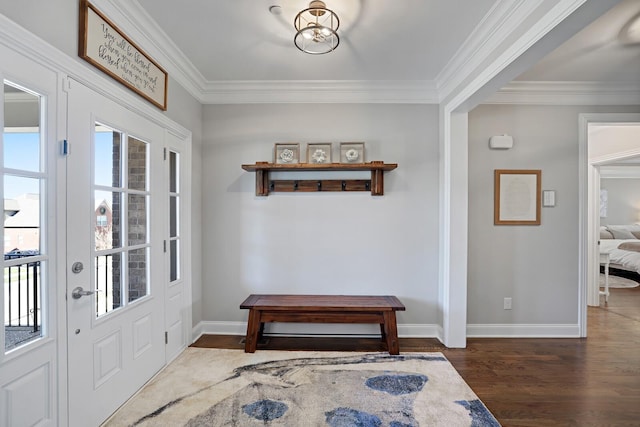 foyer featuring dark wood-type flooring and ornamental molding