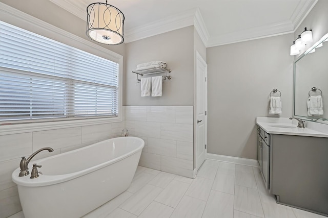 bathroom with vanity, tile walls, ornamental molding, and a bath