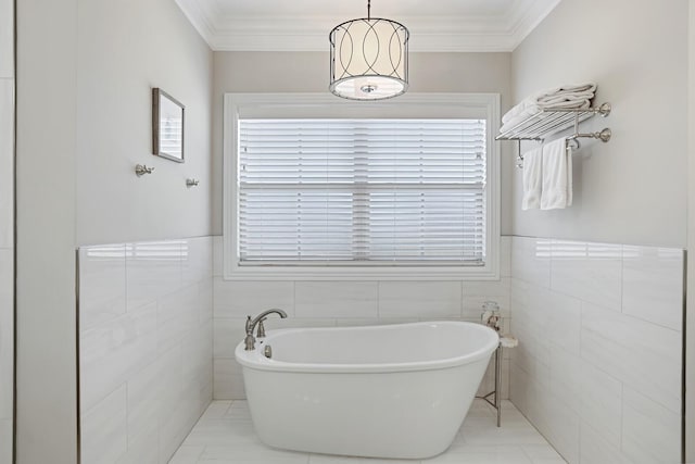 bathroom with plenty of natural light, tile walls, and a tub to relax in