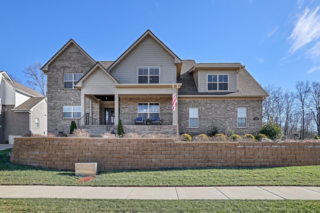 view of front of house featuring a front lawn and a porch