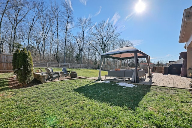 view of yard featuring a patio area, outdoor lounge area, and a gazebo