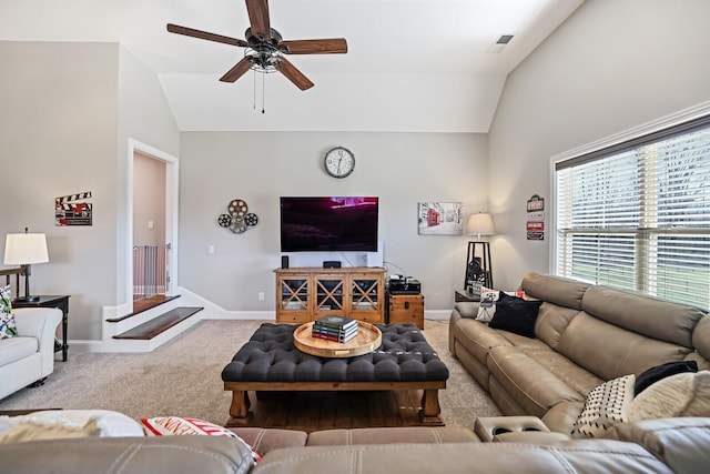 living room featuring ceiling fan, light colored carpet, and vaulted ceiling