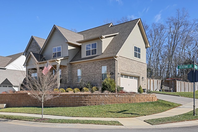 front facade with a garage and a front lawn