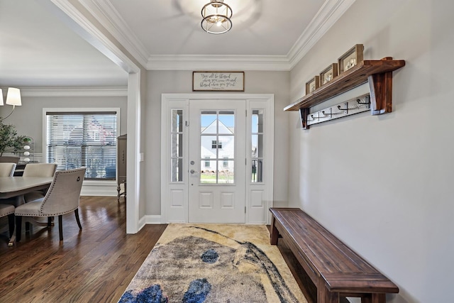 entrance foyer with dark hardwood / wood-style flooring and ornamental molding