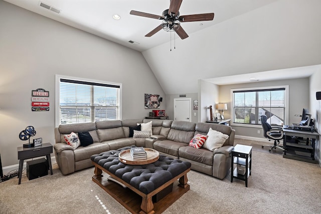 carpeted living room featuring ceiling fan and lofted ceiling