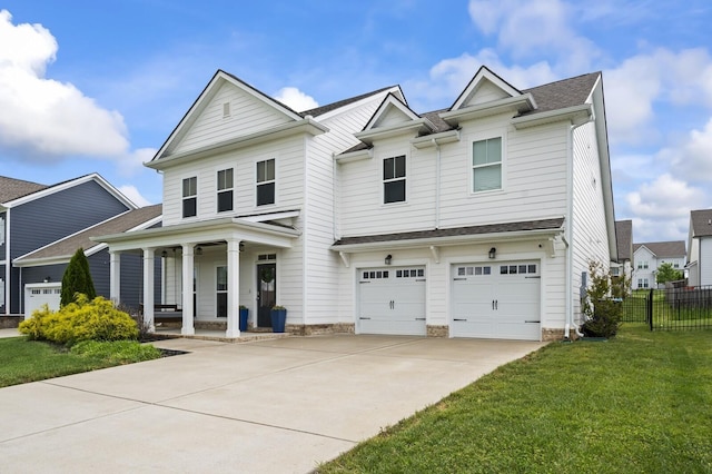 view of front of property featuring a front lawn, a porch, and a garage