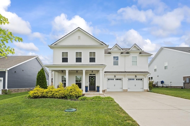 view of front of property featuring a front lawn, covered porch, and a garage