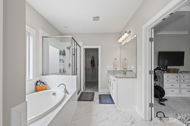 bathroom featuring independent shower and bath and vanity