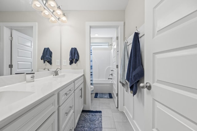 full bathroom with toilet, tile patterned flooring, vanity, and shower / bath combo with shower curtain